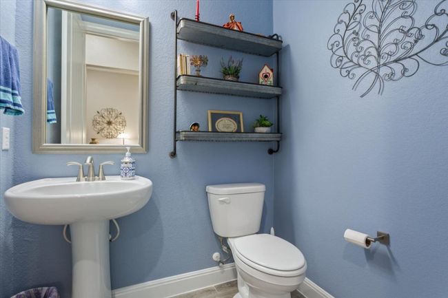 Half bathroom with a framed mirror | Image 28