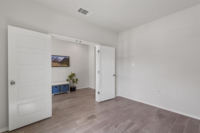 A stylish French door entry to the first floor home office. | Image 13