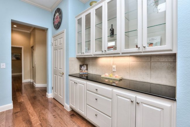 Beautiful side cabinet with granite countertop and glass shelves to display your china or collectibles. | Image 15