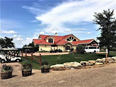 View of front of property featuring a garage and a front yard | Image 1