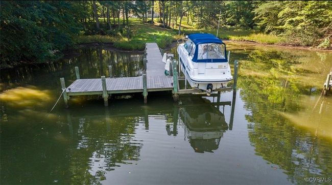 Dock with a water view and boat lift | Image 20