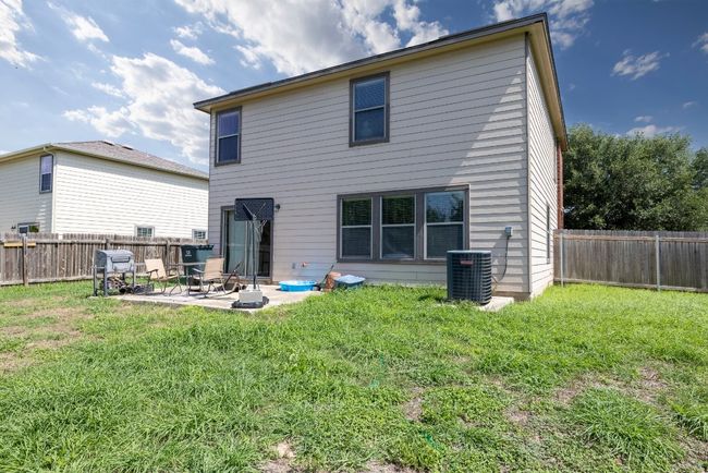 Rear view of property featuring a patio and a fenced backyard | Image 17