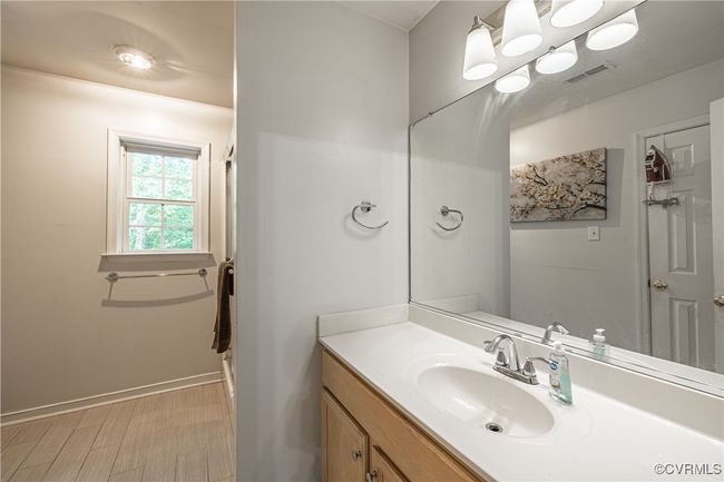 Bathroom with vanity and baseboards | Image 18