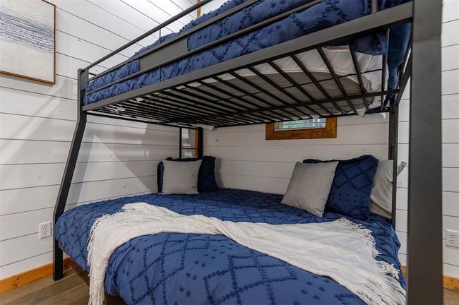 Bedroom featuring hardwood / wood-style floors | Image 33