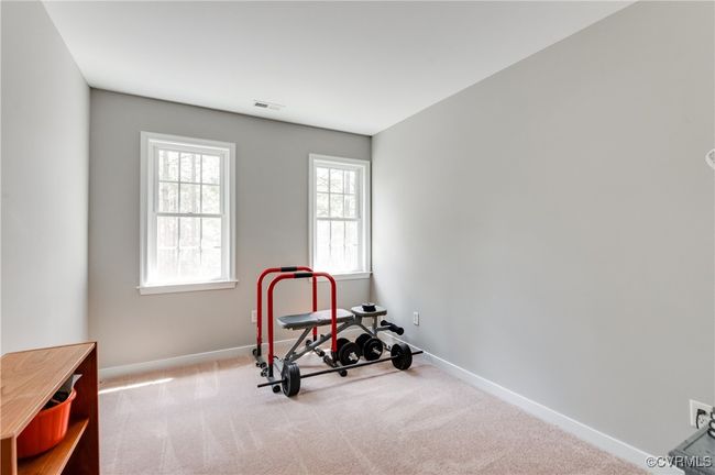 Bedroom with carpet flooring and baseboards | Image 20