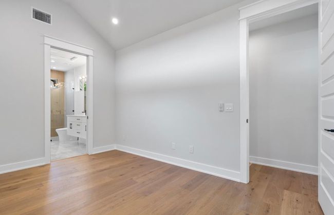 Primary Bedroom with vaulted ceiling, private balcony and tons of natural light! | Image 17