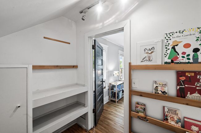 Walk-in closet includes a desk space | Image 19