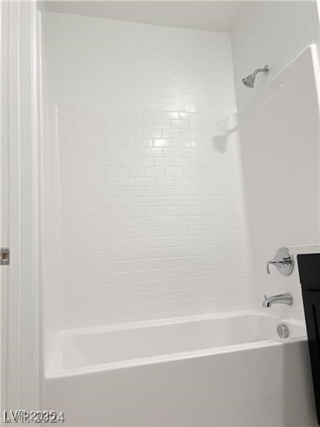 Upstairs secondary Bathroom featuring shower combination | Image 15