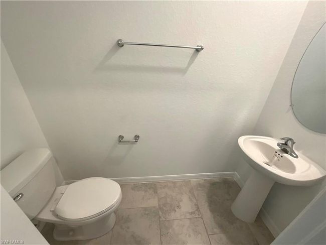 Bathroom with baseboards and toilet | Image 6