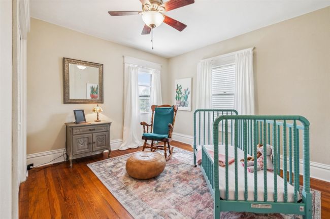 Bedroom featuring wood finished floors and a ceiling fan | Image 24