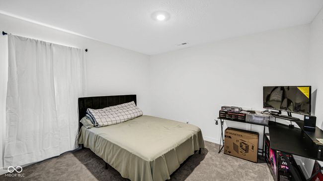 view of carpeted bedroom | Image 26