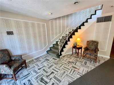 Stairs with a textured ceiling | Image 3