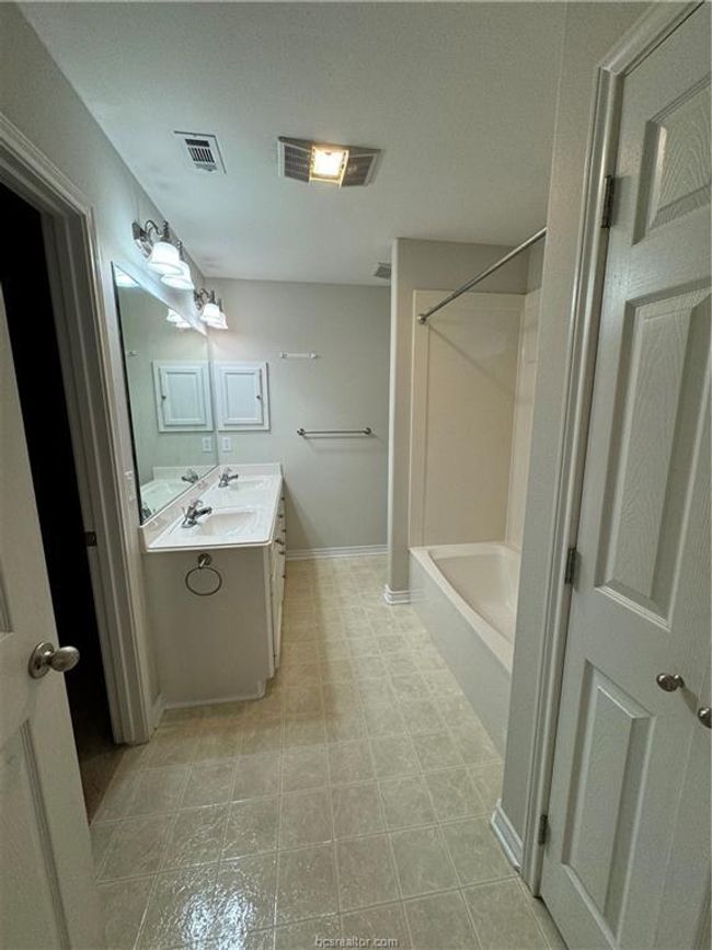 Bathroom featuring vanity and shower / tub combination | Image 10