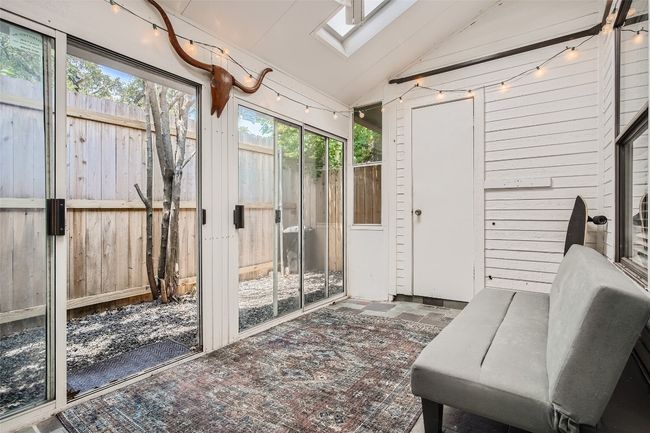 Sunroom / solarium with vaulted ceiling and a skylight | Image 18