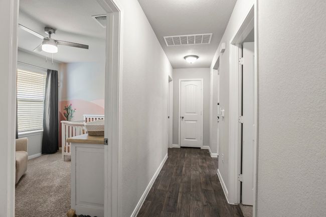 Hall with wood finished floors and baseboards | Image 23