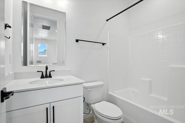 Bathroom featuring vanity and shower / tub combination | Image 15