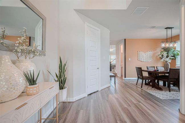 Bright and welcoming entryway leads into an open dining area. | Image 6