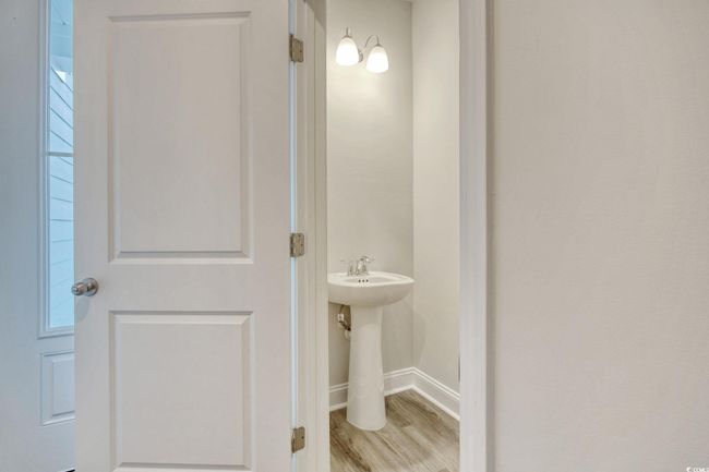 Bathroom with hardwood / wood-style flooring | Image 8