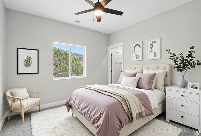 Bedroom with carpet, baseboards, and a ceiling fan | Image 35