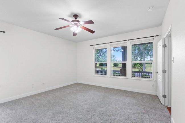 Huge master down stairs with lots of natural light and view of the golf course | Image 15