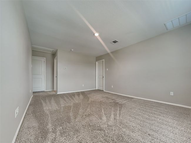 Unfurnished room with attic access, carpet, and baseboards | Image 12