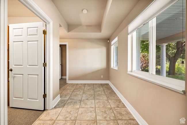 Hall featuring baseboards and a raised ceiling | Image 29
