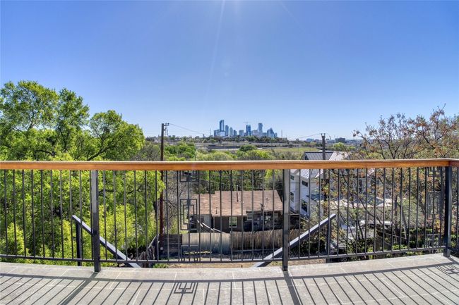 View of the city from primary bedrooms balcony | Image 13