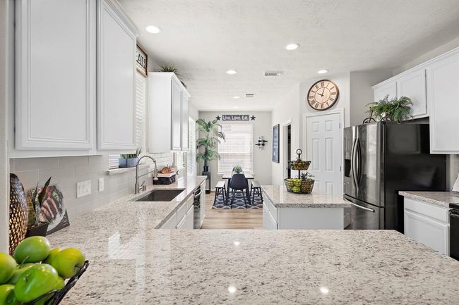 Kitchen leading into breakfast room. | Image 11