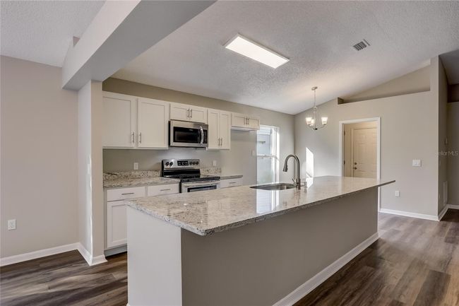 3843 Cinnamon Fern Loop, House other with 4 bedrooms, 2 bathrooms and null parking in CLERMONT FL | Image 6