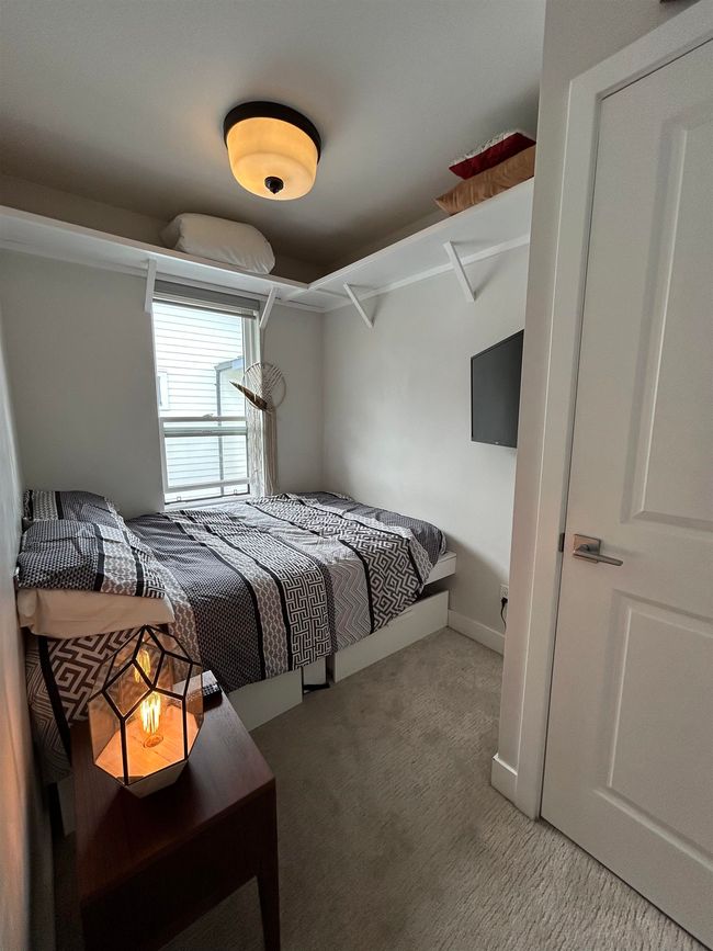 Bedroom with carpet flooring | Image 25