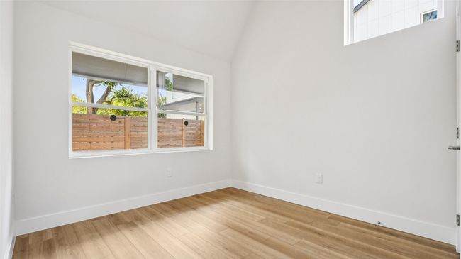 Spare room featuring wood finished floors and baseboards | Image 15