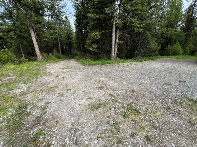 part of the extra graveled and leveled parking area | Image 82