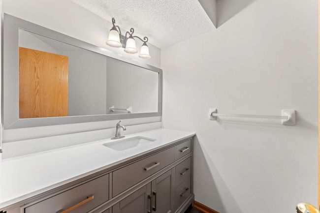 Main level bathroom attached to main level primary bedroom | Image 9