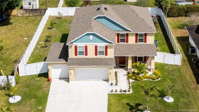 1033 Sw General Patton Terrace, House other with 6 bedrooms, 3 bathrooms and 3 parking in Port Saint Lucie FL | Image 3