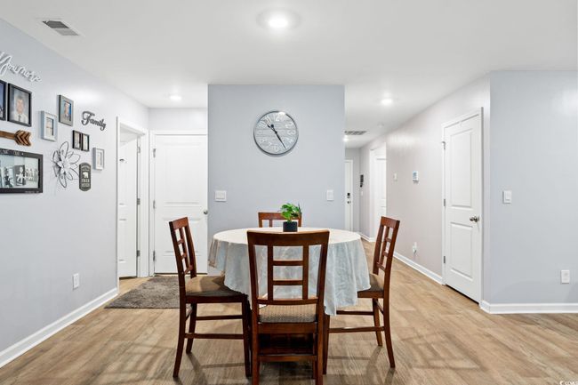 Dining room featuring light wood-type flooring | Image 11