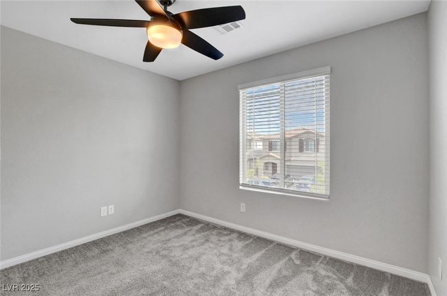 Carpeted spare room featuring baseboards and ceiling fan | Image 31