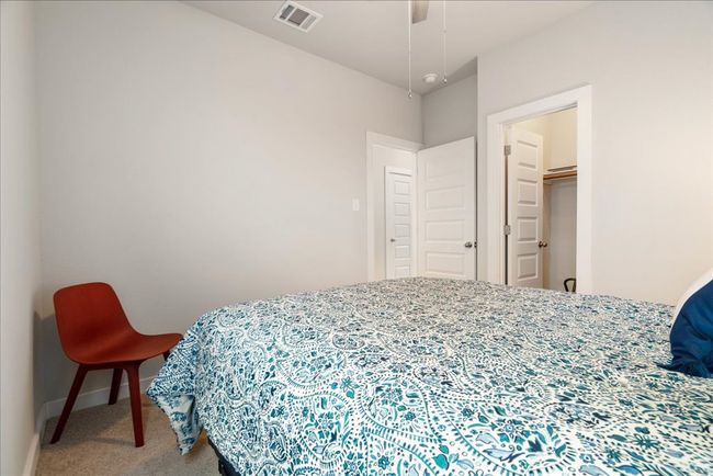 Carpeted bedroom featuring baseboards | Image 17