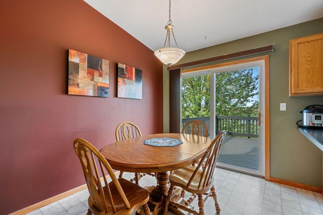 908 24th Ave NW - dining area walks out to spacious deck and the beautiful backyard and beyond | Image 6