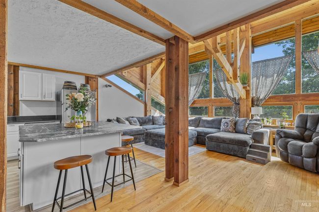 Living room with light wood-style flooring | Image 4