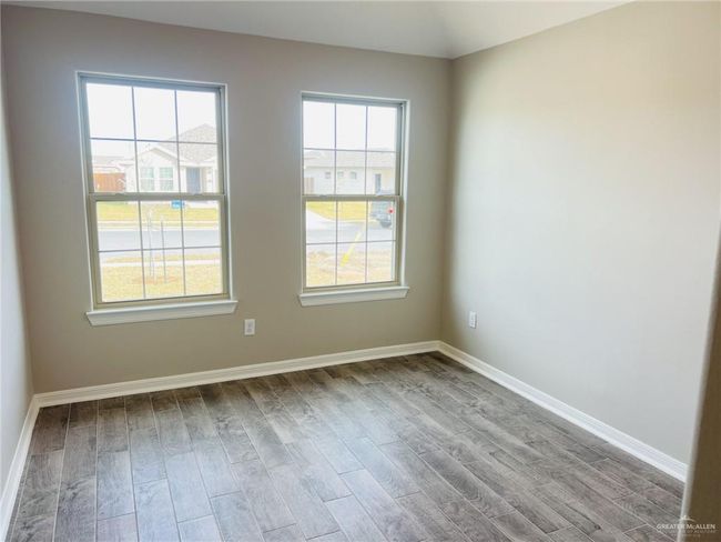 Empty room with light wood-type flooring | Image 7