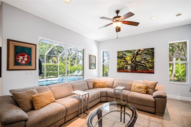 Spacious family room with large sectional and peaceful, private views of the Oscar Scherer Park! | Image 6