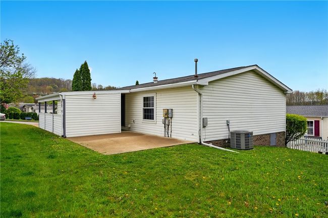 CONCRETE PATIO IN THE REAR IS BIG ENOUGH FOR A GAZEBO, PICNIC TABLE OR OUTDOOR FURNITURE. | Image 4