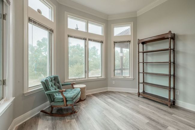 Sitting room featuring crown molding, wood floors, and baseboards | Image 21