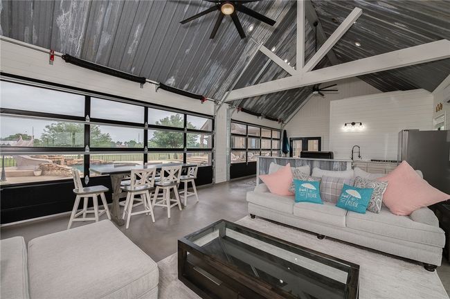Pool House roll up doors to patio area. | Image 27