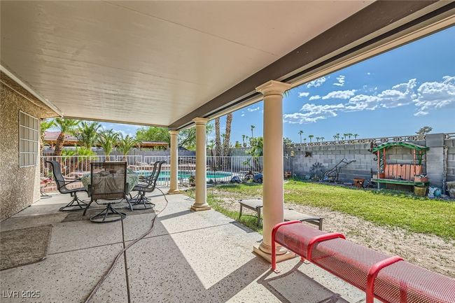 View of patio / terrace featuring a fenced backyard and a fenced in pool | Image 24