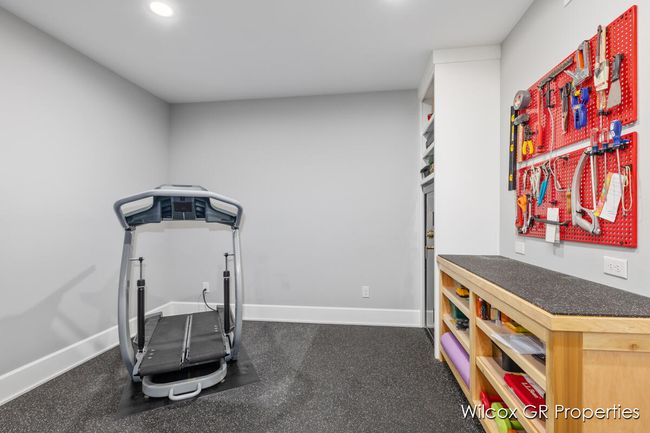 Lower level walkout includes a9' ceilings, and a perfect space for many options including home gym, office, entertainment, work shop with additional storage. | Image 32