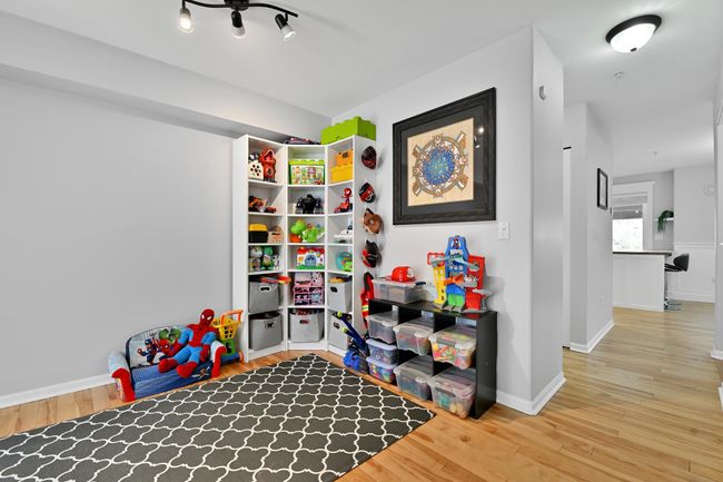 Recreation room with baseboards and wood finished floors | Image 9