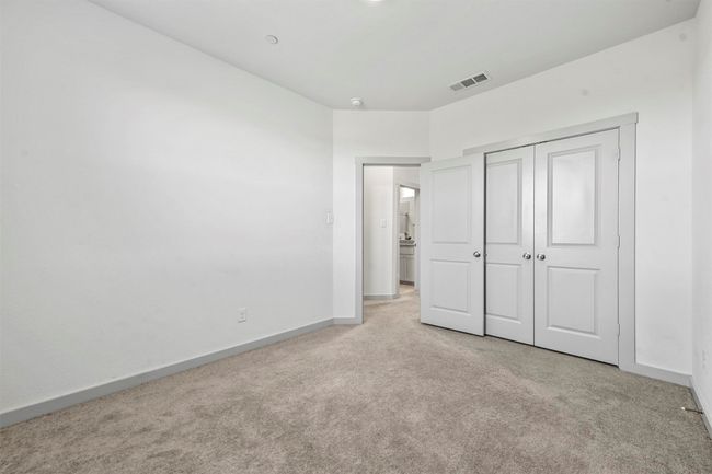 Unfurnished bedroom with light colored carpet and a closet | Image 31