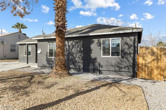View of front of house featuring stucco siding and fence | Image 4