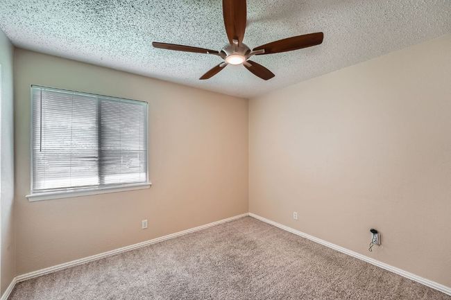 Bedroom #3 also offers great natural light and a ceiling fan with remote control. | Image 10